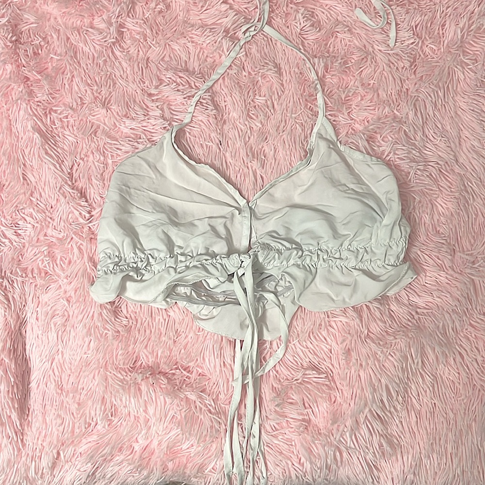 White crop top with ruffly ends